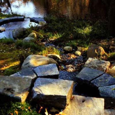A pile of stones near a river